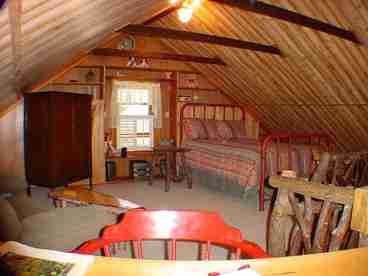UPSTAIRS LOFT BEDROOM WITH A READING ROOM