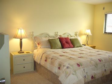King sized bed, walk in closet, & views.