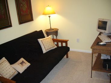 Loft.  Futon can be folded down to make a full sized bed. Also has computer with internet access.
