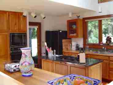 This fully equipped kitchen and dining area is a perfect place to enjoy dining after a day in the mountains.