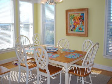 Sunlight pours into the Dining Room, adding to the atmosphere of island living.