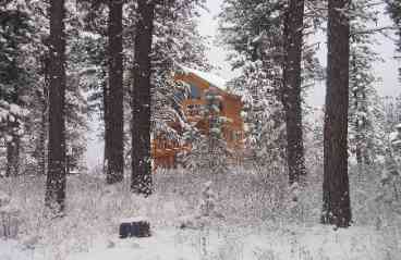 Winter view of cabin from golf course
