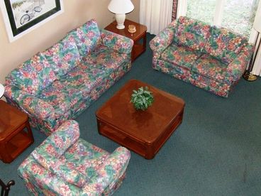 View of the living room area from the spiral staircase.