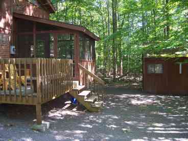 Whether rain or shine you can relax, eat or entertain on the screen porch and outside deck which overlooks the peaceful woods.