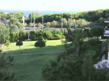 The ample terrace looks out across the gardens of Calahonda Park towards the Mediterranean Sea.