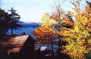 2- Story Gambrel Lodging Cabin features large outside deck facing west affording lake views. A perfect place to relax and enjoy the view.