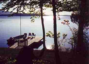 Waterfront dock and sandy swimming beach just steps away !