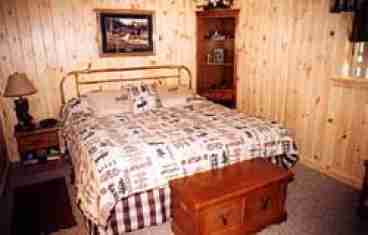 Lower level masterbedroom features oversized room with King Bed and sitting area