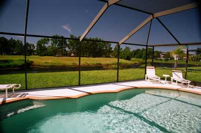 Pool with view across the lake and golf course.