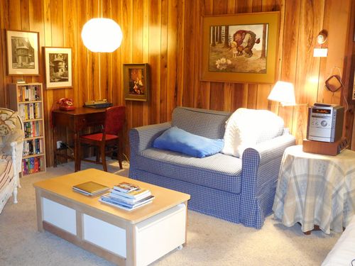 Our living room has a sofabed, sound system and many videos.