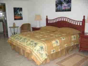 2nd Master bedroom with sliding glass door onto the balcony and the dazzling carribean.