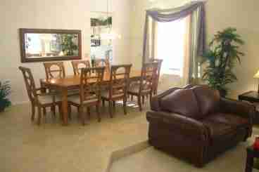 The formal dining room has seating for eight.
