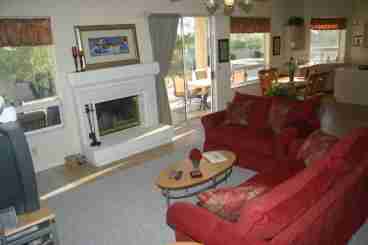 The family room includes a fireplace, TV and stereo, and queen sized sofabed.