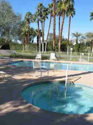 one of 21 swimming pools and spas free for use within the gated country club