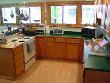 Kitchen area with all new stainless steel appliances