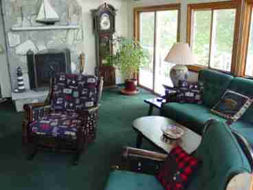 Living Room with sky lights and water views from every window.  Walk out to to wrap around deck