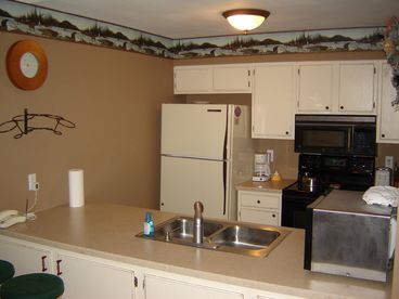 Full kitchen with cookware, dishes, silverware, and more