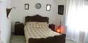 bedroom, this room has a balcony. We are constantly changing it with decor we bring from Morocco.