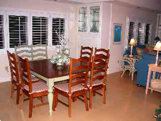 Large Dining Room with Family Style gathering  table easily seats 8.