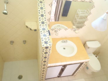 Cheery, all tile, airy bathroom