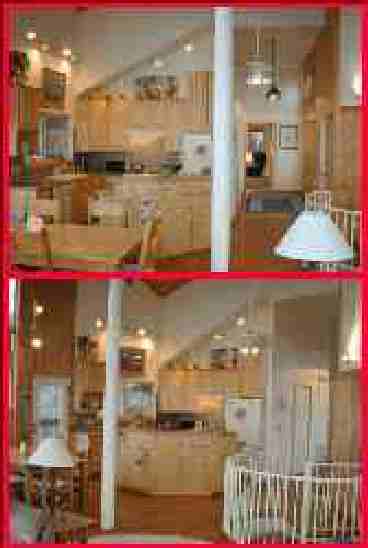 Fully-equipped kitchen with all appliances including large refrigerator.