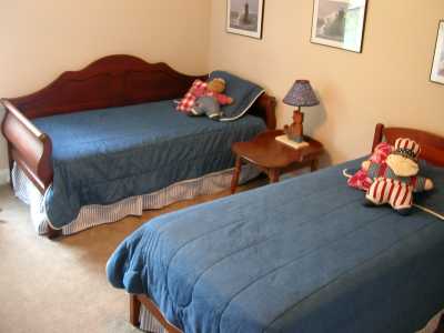 The front bedroom upstairs features two twin beds with an extra trundle for the larger groups.