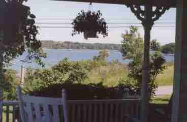 Enjoy the views from the porch rockers.  Hummingbirds are frequent visitors to the hanging fushias.