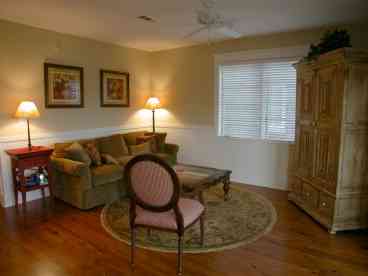 Living Area with oversized down-filled couch, 36 inch flat screen TV, DVD and stereo.