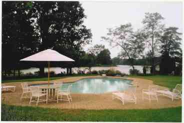 Manor pool with tennis court