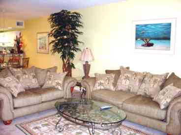 Modern spacious livingroom with sliding glass doors leading to a private balcony!