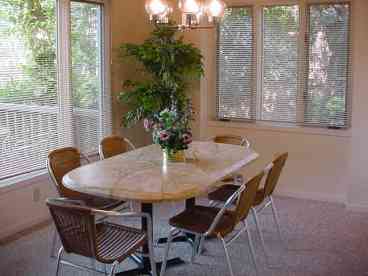 Light and airy dining room opens out to rear deck with lagoon view.