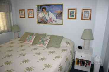 Our lovely Hawaiiana Suite air-conditioned bedroom.