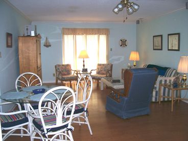 Expansive and oh, so charming living and dining area for family vacation fun!
