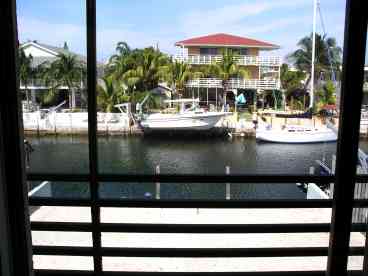 View of our wide deep water canal BEFORE tiki and landscaping were complete