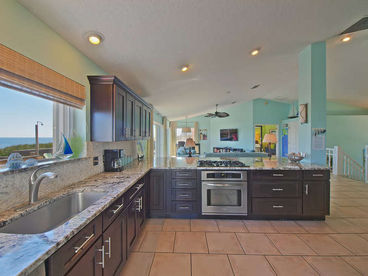 The kitchen is fabulous, with granite counters, stainless appliances, gas cook top, and breakfast area. 