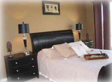 Luxurious Master Bedroom Suite with private doors to Palm Valley 9th hole
