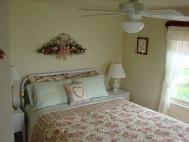 Romantic queen bedroom. Small, but pretty. BeautyRest mattress. Ceiling fan. Small flatscreen TV.
