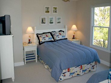 2nd Bedcroom sleeps 3 with a queen and twin bed.