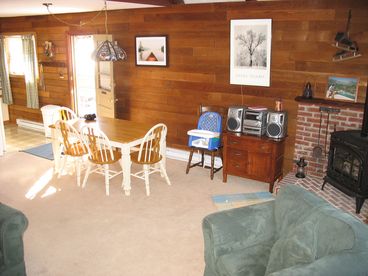 Enjoy dining in this open floor plan next to the gas burning stove. 
