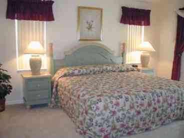 Master bed 1 with walk-in closets and overlooking the pool