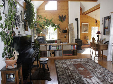 Large living/dining room with cathedral ceiling
for your leisure times.