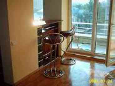 View of the eating bar and french doors to the terrace.