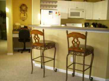 View of kitchen and bar and workcenter.