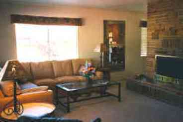 Master House Living Room with comfortable fold out Queen bed with wood burning fireplace.