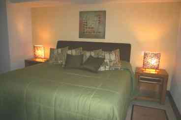 King size bed.  Access to balcony with spa from bedroom.  Walk-in closet and private bathroom.