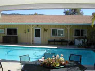 view of pool and side entry