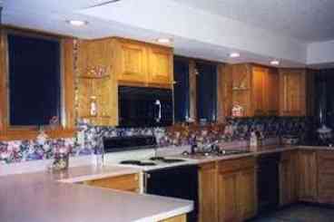 Large spacious kitchen with ample countertop, and large pantry for storing all those vacation items out of sight.
