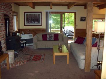 Living room with access to the oversized, wrap-around deck