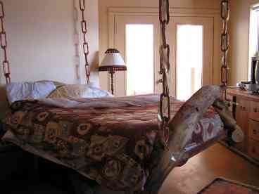 Hanging bed in master bedroom. Shower has 5 jets!
