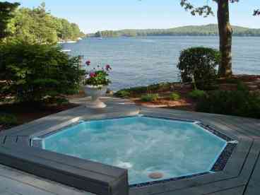 Picture yourself in the hot tub, perhaps with a glass of wine, watching the sunset over the mountains across the lake.  Sweet!
